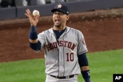 FILE - Houston Astros first baseman Yuli Gurriel (10) reacts after making the play in the American League Championship Series against the New York Yankees on Oct. 15, 2019, in New York. (AP Photo/Seth Wenig)