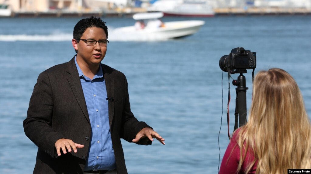 Kansas' KLWN radio journalist Tyler Jones (Choctaw) broadcasting from Miami, FL, during 2018 Native American Journalists Association (NAJA) conference, July 21, 2018. Photo by: Frank Robertson