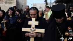 Christian pilgrims attend Good Friday procession in Jerusalem, April 14, 2017.
