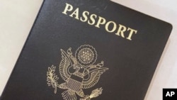 FILE - A U.S. passport cover is seen in Washington, D.C., May 25, 2021.