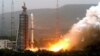 FILE - Photo released by China's Xinhua News Agency shows Olympic weather forecasting satellite, the Fengyun-3 (FY-3), launched on a Long March-4C carrier rocket from the Taiyuan Satellite Launch Center in northern Shanxi Province.