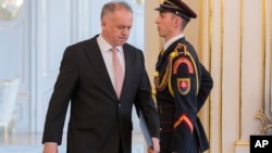 Slovakian President Andrej Kiska arrives at the press conference at Presidential Palace in Bratislava, March, 20, 2018. Slovakia's president has rejected a proposal for a new government following a crisis triggered by the killing of a journalist and his fiancee.