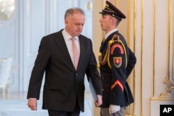 FILE - Slovakian President Andrej Kiska arrives at the press conference at Presidential Palace in Bratislava, March, 20, 2018.