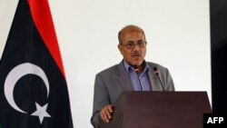 Libyan government's spokesman Ahmad Lamin holds a press conference in the capital as deadly clashes rage around the country's main international airport, in Tripoli, Libya, July 13, 2014.
