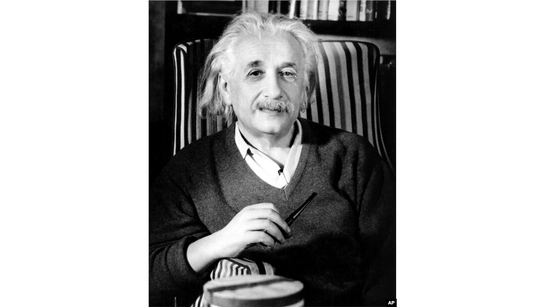 FILE - Prof. Albert Einstein is shown a few days before his 70th birthday in his home in Princeton, N.J., in March 1949.