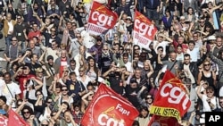 Followers of the CGT Union (General Confederation of Work) attend a protest march in Marseille, southern France, over the government's attempt to raise the retirement age by two years to save money, 12 Oct 2010