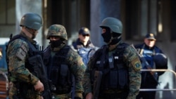 Heavily armed Macedonian police guard the premises of a court, during the final verdict for 37 people arrested and charged with terrorism-related offenses for clashes with Macedonian police in 2015 in Kumanovo, in Skopje, Macedonia, Nov. 2, 2017.