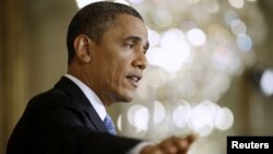 President Barack Obama answers questions during a news conference in the East Room of the White House in Washington, January 14, 2013.. 