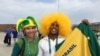 Two fans show their true colors at the Olympic Games in Rio de Janeiro, Brazil, Aug. 8, 2016. (P. Brewer/VOA)