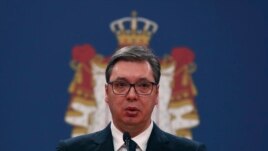 In this March 15, 2020, photo, Serbian President Aleksandar Vucic speaks during a news conference in Belgrade, Serbia. Since declaring nationwide state of emergency Vucic has suspended parliament, giving him widespread powers.