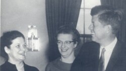 Nancy Grace Roman, center, with President John F. Kennedy in the Oval Office at the White House in 1962