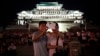 FILE - A North Korean couple use their smartphone to photograph fireworks in Pyongyang, July 27, 2014.