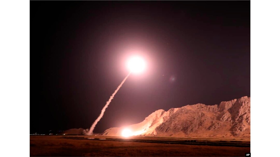 In this photo released on Oct. 1, 2018, by the Iranian Revolutionary Guard, a missile is fired from city of Kermanshah in western Iran targeting the Islamic State group in Syria.