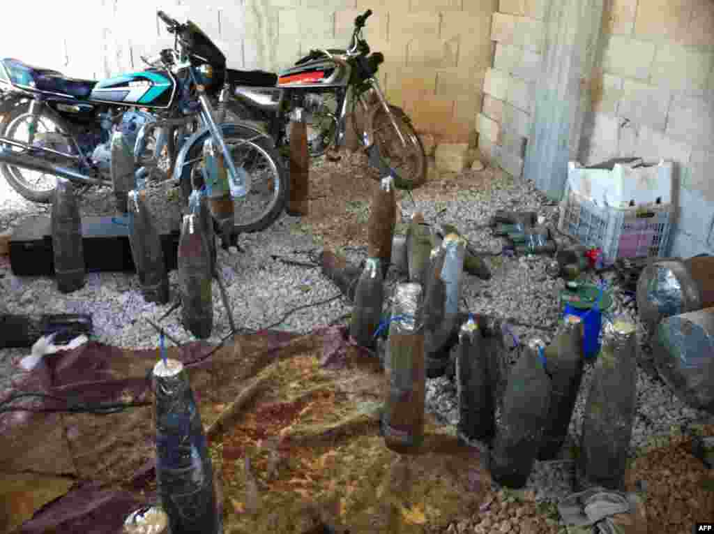 Homemade weapons left by Syrian rebels are pictured, after the army seized control of the city of Qusair and the surrounding region in Syria&#39;s central Homs province. 
