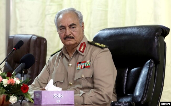 FILE - Libya's eastern-based commander Khalifa Haftar attends a security conference, in Benghazi, Libya, Oct. 14, 2017.