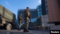 Belgian soldiers patrol outside the European Commission headquarters in central Brussels Jan. 17, 2015.