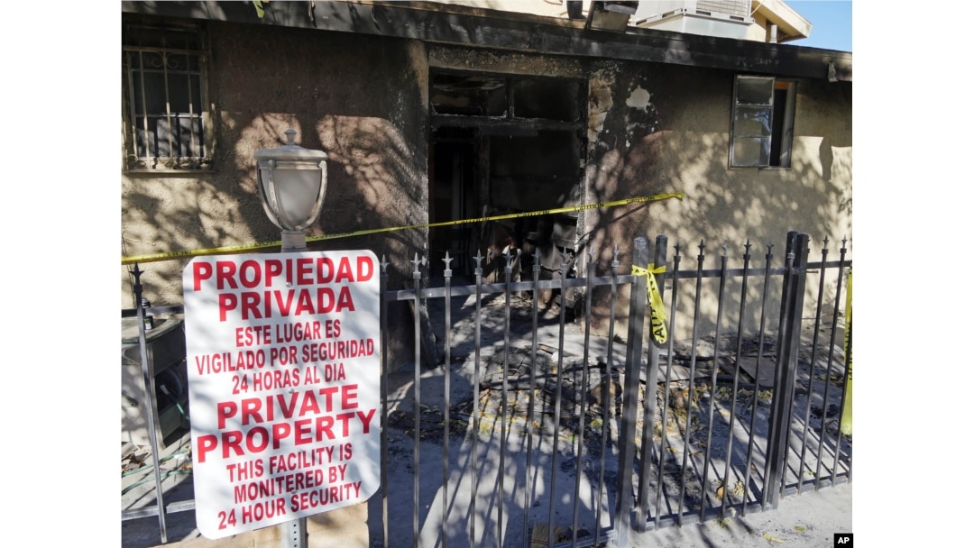 Police tape marks off the burned front lobby of the Islamic Center of Palm Springs in Coachella, Calif., Dec. 12, 2015.