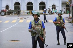Sri Lankan Naval soldiers stand guard outside St. Anthony's Church in Colombo, April 29, 2019.