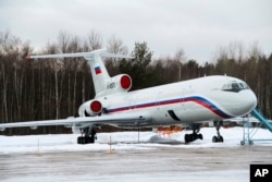 FILE - This photo shows the Tu-154 plane with registration number RA-85572 at a military airport near Moscow. This plane was taking the Alexandrov Ensemble to a concert at the Russian air base in Syria when it crashes just after takeoff from Sochi.