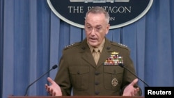 FILE - U.S. Joint Chiefs of Staff Chairman General Joseph Dunford speaks to the media at the Pentagon.