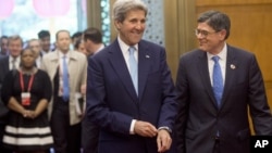 U.S. Secretary of State John Kerry, left, and U.S. Treasury Secretary Jacob Lew arrive for a roundtable breakfast with CEOs during the U.S.-China Strategic and Economic Dialogues at Diaoyutai State Guesthouse in Beijing, June 7, 2016.