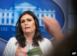 White House press secretary Sarah Huckabee Sanders talks to reporters during a press briefing in the Brady Press Briefing Room at the White House, in Washington, Nov. 27, 2017.