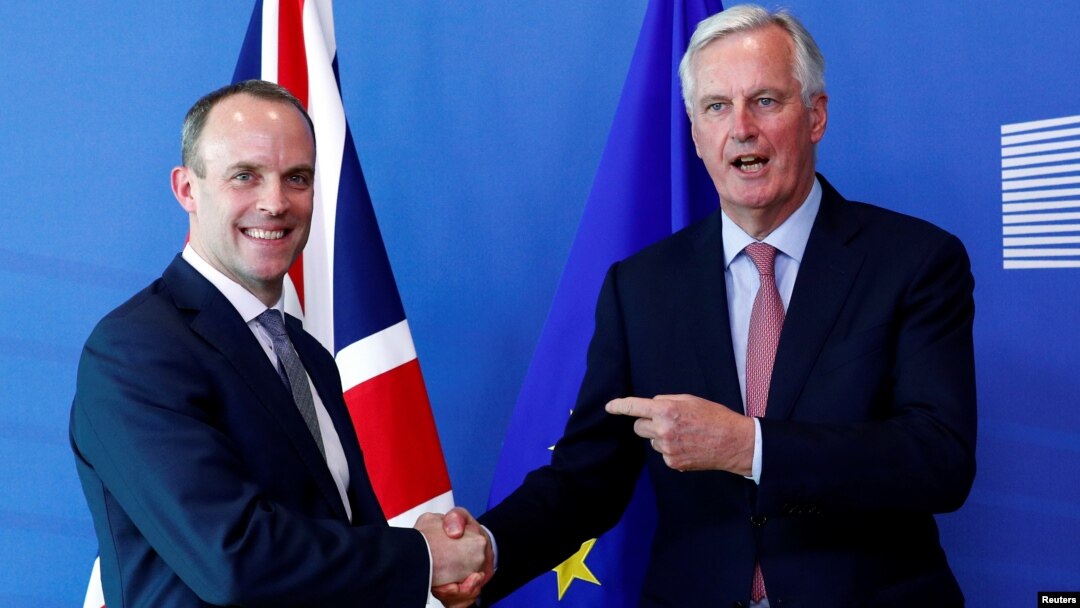 Britain's Secretary of State for Exiting the European Union, Dominic Raab and European Union's chief Brexit negotiator, Michel Barnier, pose ahead of a meeting in Brussels, Belgium, July 19, 2018.
