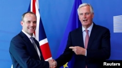 Britain's Secretary of State for Exiting the European Union, Dominic Raab and the European Union's chief Brexit negotiator, Michel Barnier, at a meeting in Brussels, Belgium, July 19, 2018.