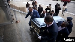 Pallbearers carry the casket of Quintonio LeGrier during his funeral in Chicago, Jan. 9, 2016. LeGrier was fatally shot by a Chicago police officer after allegedly swinging a baseball bat at him.