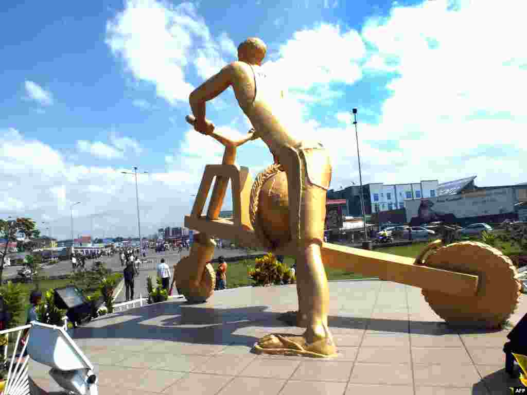 A sculpture of a man riding a tshukudu, wooden scooters used to transport goods in the eastern Democratic Republic of Congo city of Goma.