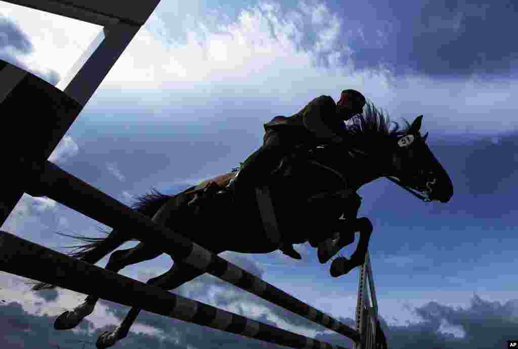 German Josef Fuchs and his horse &#39;Aragon&#39; clear a hurdle during the fault and style jumping at the 4th International Open German Cavalry Championship in Crawinkel, central Germany.