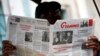 FILE - A man reads the official newspaper of the Central Committee of the Cuban Communist Party, Granma, in old Havana, Feb. 3, 2015.