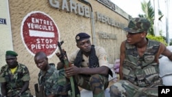 Troops from the Republican Forces of Ivory Coast guard a base in Ivory Coast's main city, Abidjan, April 18, 2011. 