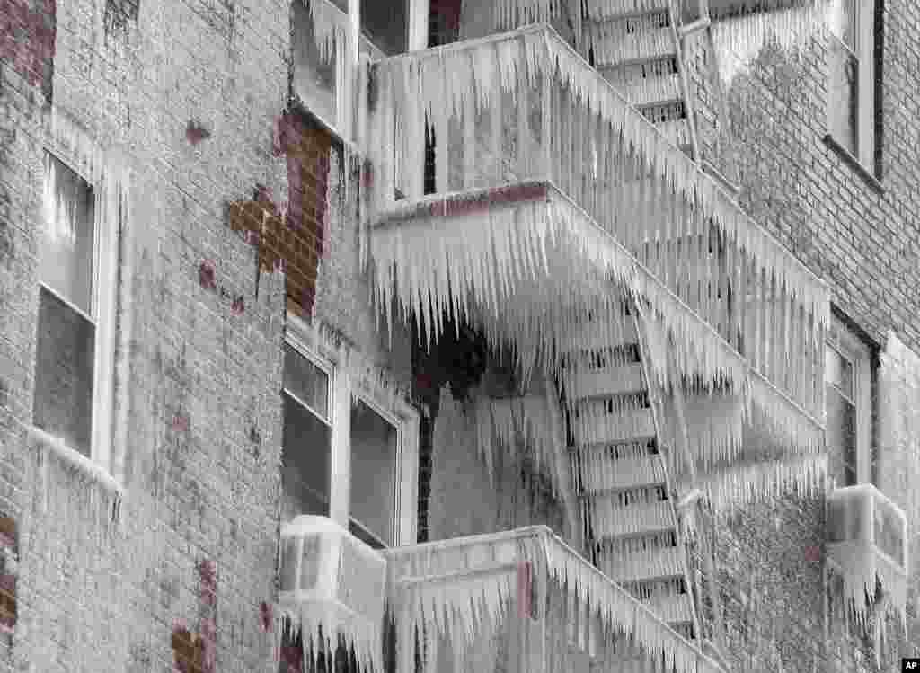 Ice covers the fire escape of an apartment building that caught fire in Yonkers, New York, March 15, 2017.