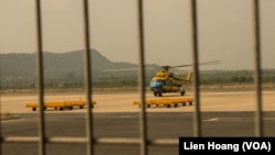 A helicopter takes off Tuesday from Vietnam's southwest Phu Quoc Island to search for the passengers of Malaysian Airlines flight MH370. (Photo: Lien Hoang for VOA)