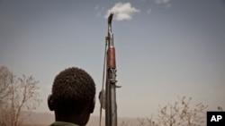 A Sudan People's Liberation Movement (SPLA-N) rebel soldier looks out toward Talodi, in South Kordofan, a region of Sudan, on April 25, 2012