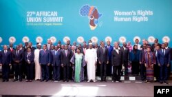 FILE - Heads of state and government pose during a photo call before the official opening of the 27th African Union (AU) Summit in Kigali on July 17, 2016. 