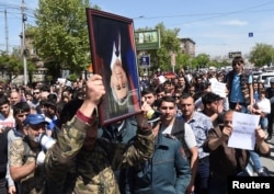 Demonstrators attend a protest after parliament voted to allow former president Serzh Sarksyan to become prime minister, in Yerevan, Armenia, April 19, 2018.