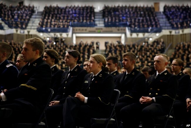 Members of the U.S. Naval Academy listen as Sen. John McCain, R-Ariz., is introduced by former Sen. John Warner, R-Va., at the Academy in Annapolis, Maryland, Oct. 30, 2017.