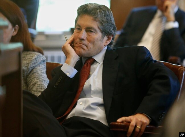 Larry Ottaway, one of the attorneys for Johnson & Johnson, listens during the state's opening arguments, May 28, 2019, in Norman, Oklahoma.