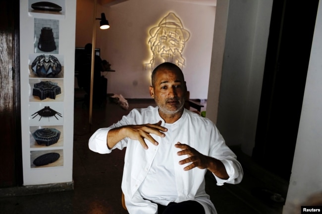 Artist Marco Castillo speaks during an interview at his studio in Havana, Cuba, September 12, 2018. Picture taken on September 12, 2018. REUTERS/Alexandre Meneghini