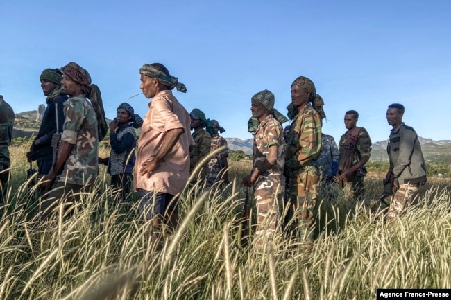 FILE - Amhara militia men, that combat alongside federal and regional forces against northern region of Tigray, receive training in the outskirts of the village of Addis Zemen, north of Bahir Dar, Ethiopia, Nov. 10, 2020.