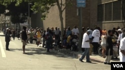 People line up on Skid Row in Los Angeles to receive food, water, clothing and other basic necessities from Humanitarian Day Muslim volunteers.