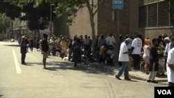 People line up on Skid Row in Los Angeles to receive food, water, clothing and other basic necessities from Humanitarian Day Muslim volunteers.