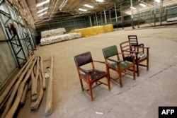 FILE - An almost empty food warehouse rented by NGO Oxfam Malawi to stock the maize for the needy is seen in Luchenza, south of Blantyre, Malawi, Oct. 11, 2005.