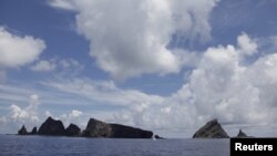 A group of disputed islands known as Senkaku in Japan and Diaoyu in China is seen from the city government of Tokyo's survey vessel in the East China Sea, September 2, 2012.