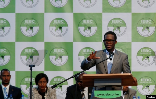 FILE - Chief Electoral Officer of Kenya's Independent Electoral and Boundaries Commission (IEBC) Ezra Chiloba speaks during a news conference ahead of the announcement of the winner of polls in Kenya's election at the Bomas of Kenya, in Nairobi, Kenya, Au