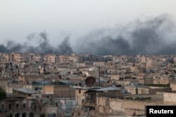 Smoke rises after airstrikes on the rebel-held al-Sakhour neighborhood of Aleppo, Syria, April 29, 2016.