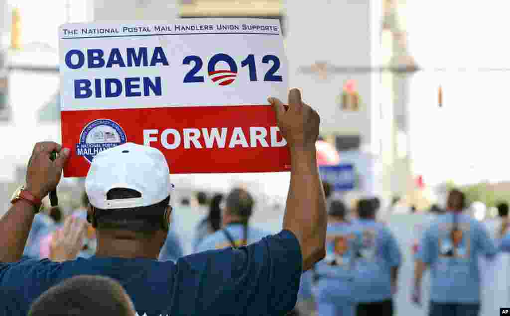 Demonstrators march in a Labor Day parade in Charlotte, North Carolina, September 3, 2012.