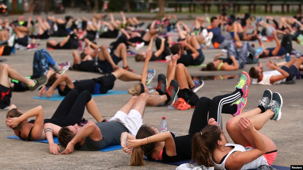 Health experts say it is important to stay active. Here, people come together for a public exercise event in Nantes, France, Sept. 2017. (REUTERS/Stephane Mahe)